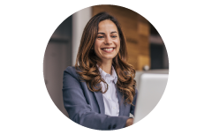 Agent smiling at computer helping a customer.