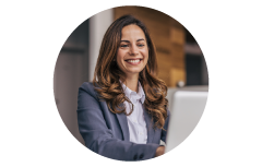 Agent smiling at computer helping a customer. Agent smiling at computer helping a customer.