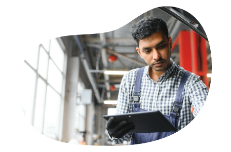 An employee at an auto detailing shop goes through a checklist.