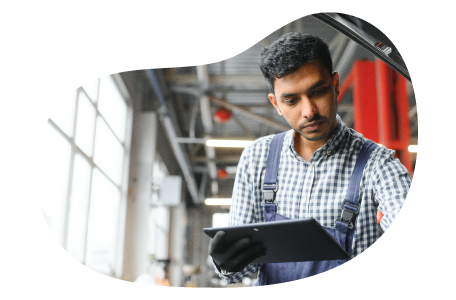 An employee at an auto detailing shop goes through a checklist. An employee at an auto detailing shop goes through a checklist.