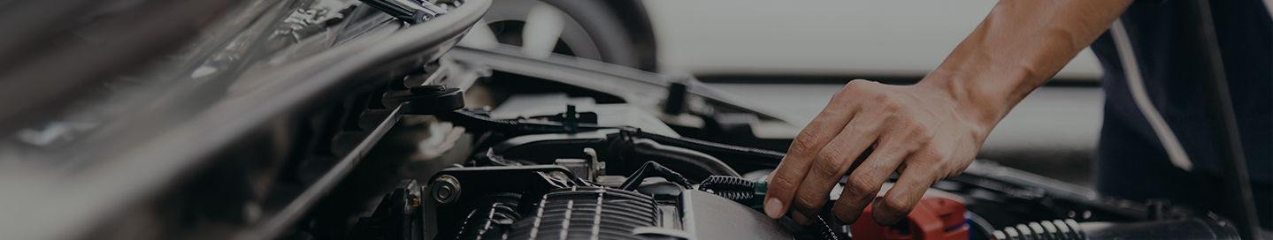 A mechanic goes through a checklist to evaluate a customer's car. A mechanic goes through a checklist to evaluate a customer's car.
