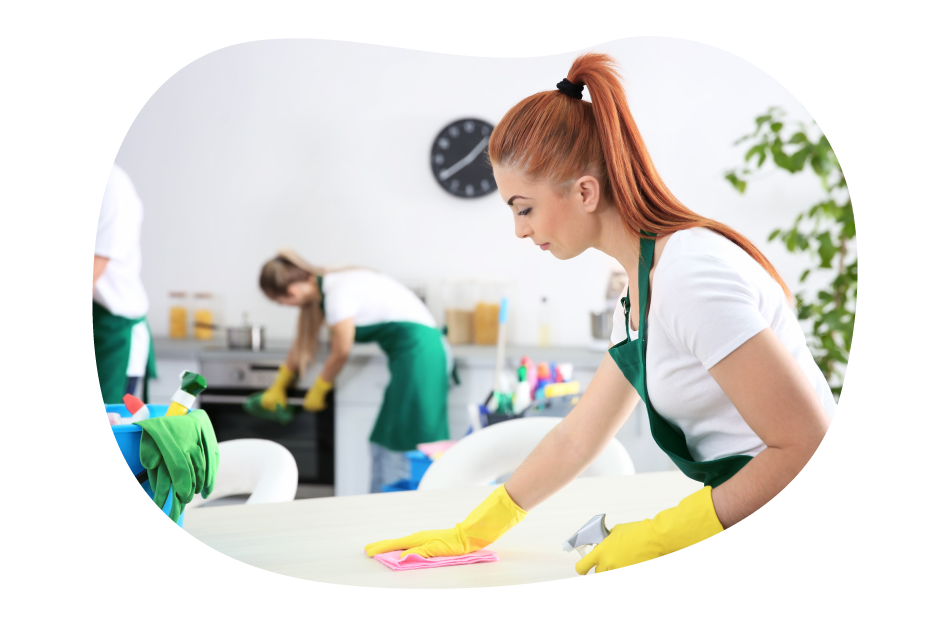 House cleaners cleaning up a client's break room.