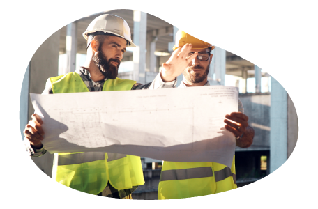 A general contractor discussing their construction plan with a subcontractor A general contractor discussing their construction plan with a subcontractor