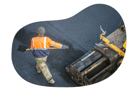 A paving contractor spreading asphalt.