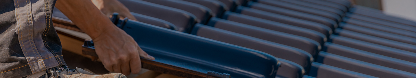 Roofing professional installing materials