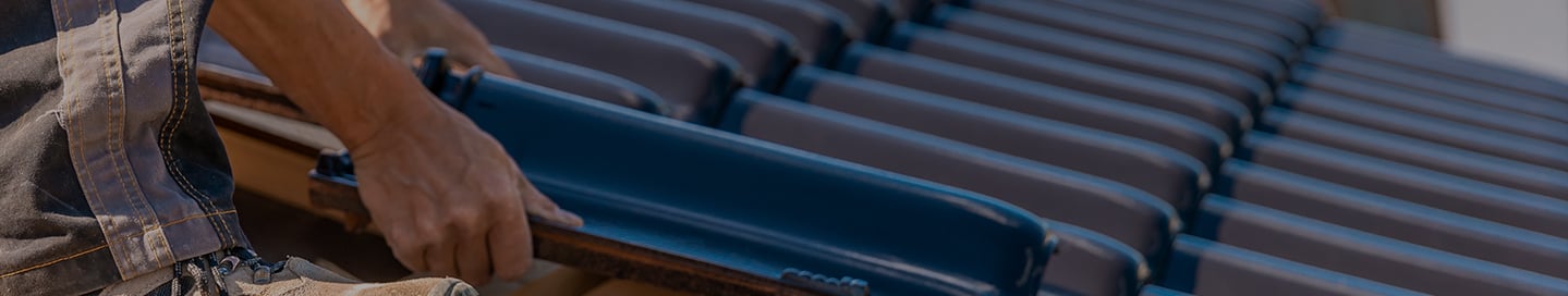 Roofing professional installing materials Roofing professional installing materials