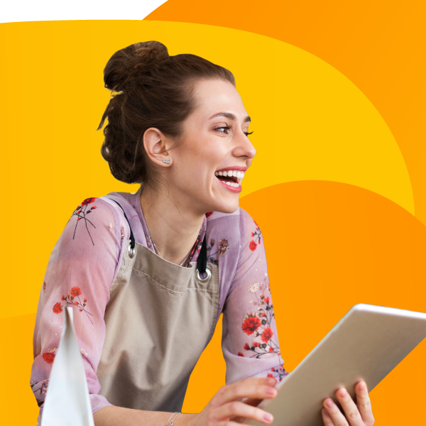 Happy smiling barista holding iPad