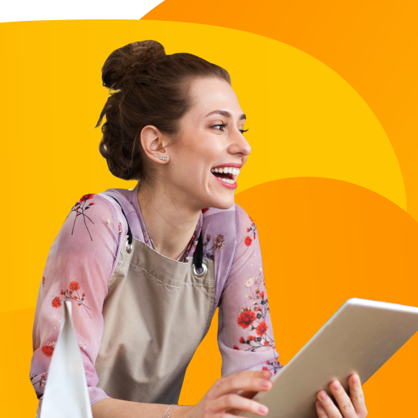 Happy smiling barista holding iPad