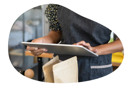 A restaurant owner calculates insurance costs on a tablet.