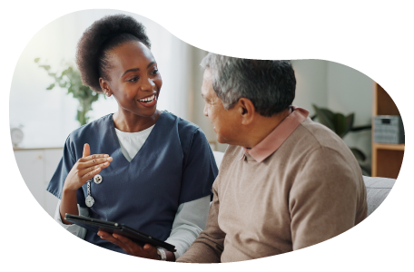 A caregiver helping a client. A caregiver helping a client.