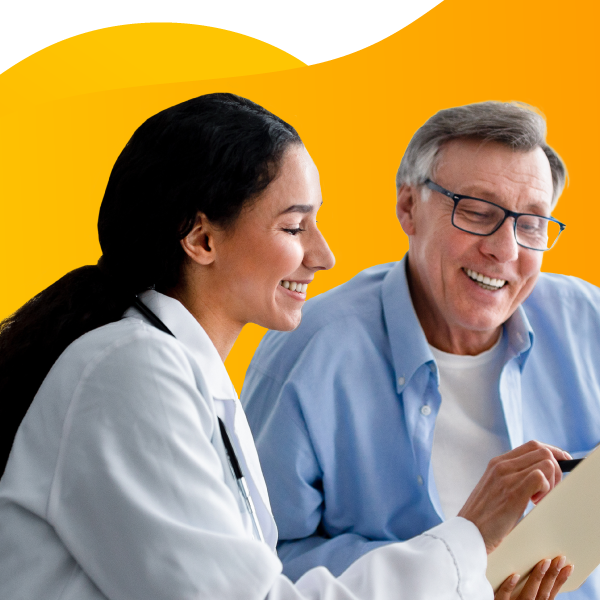 Home health aide speaking with patient.
