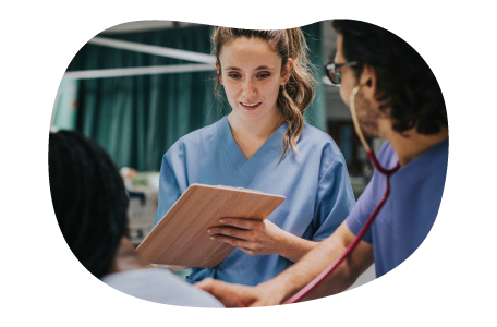 Nurses discussing a patient's chart.