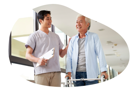 An occupational therapist helps a patient walk during a therapy session
