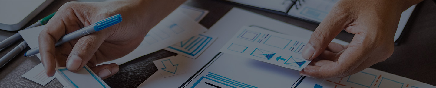 Mobile app developer sketching a prototype.