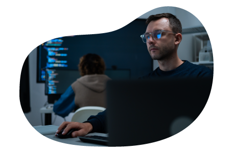 Employee at a cloud computing company working on a laptop.