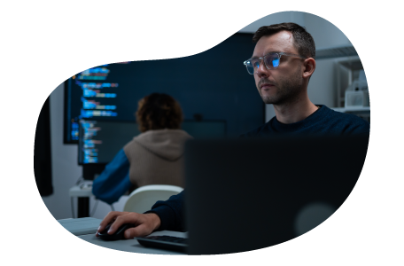 Employee at a cloud computing company working on a laptop. Employee at a cloud computing company working on a laptop.