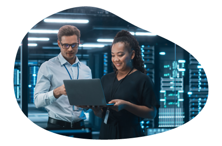 Employees at a cloud computing company working on a laptop. Employees at a cloud computing company working on a laptop.