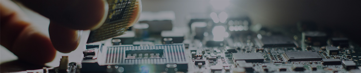 Person repairing computer circuit board.