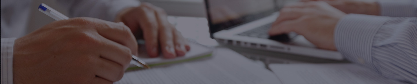 Data analysts reviewing data at a desk. Data analysts reviewing data at a desk.
