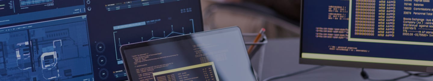 Data analysts reviewing data at a desk.