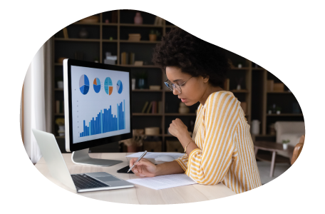 Data analyst professional examining trends on a computer.