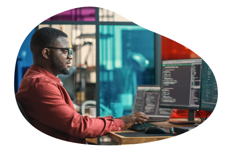 Data architect reviewing programming code on a computer. Data architect reviewing programming code on a computer.