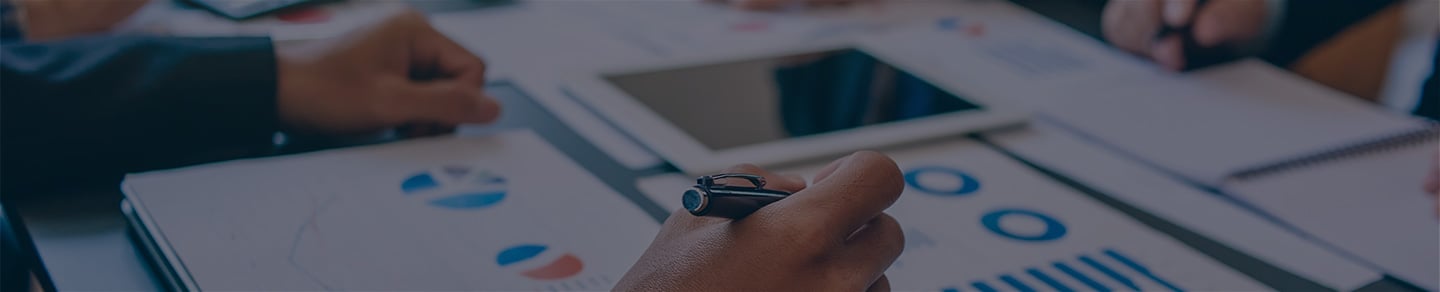 Marketing executive reviewing paperwork. Marketing executive reviewing paperwork.