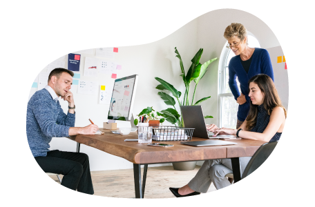 Digital marketers reviewing a project plan in an office.