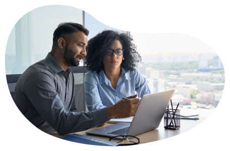 IT consultant and client examining a laptop.