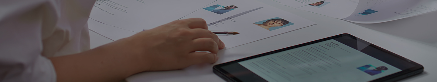 IT staffing agency employee reviewing documents.