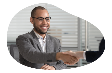 IT staffing agency representative shaking hands with a client. IT staffing agency representative shaking hands with a client.