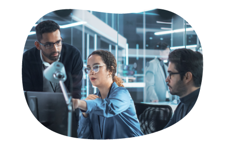 An IT trainer providing instruction to other employees.