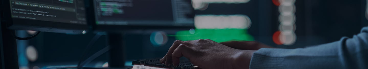 A penetration tester working at a computer. A penetration tester working at a computer.