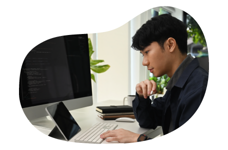 SEO and SEM consultant at a desk looking at data.