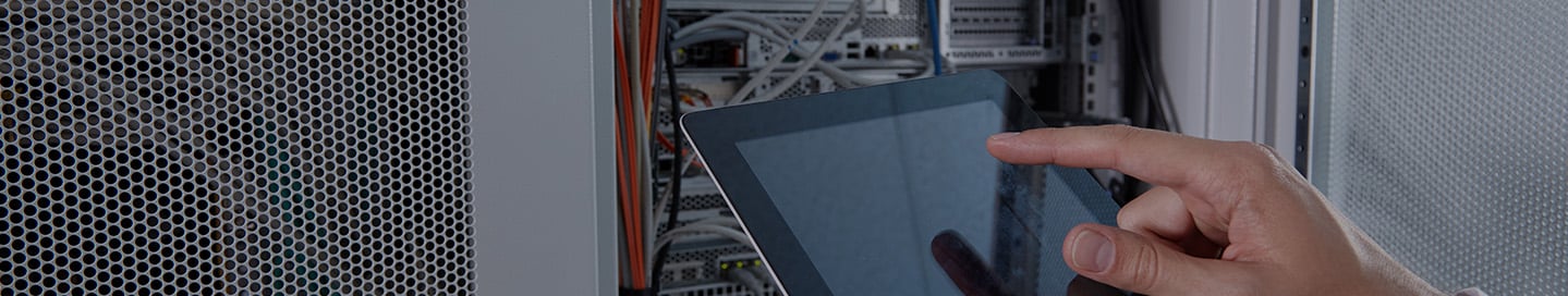 Specialist working on hardware systems integration in a data center. Specialist working on hardware systems integration in a data center.