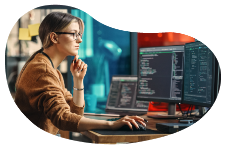 Web developer reviewing website programming code on a computer. Web developer reviewing website programming code on a computer.