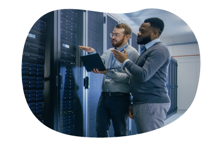 Web hosting technicians evaluating a mainframe structure.