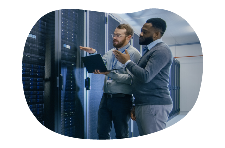 Web hosting technicians evaluating a mainframe structure. Web hosting technicians evaluating a mainframe structure.