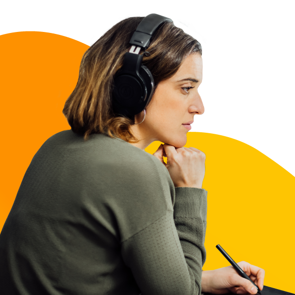 Graphic design professional creating an illustration at their desk for a client.