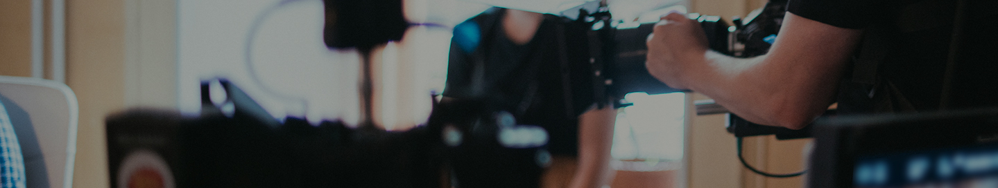 A camera operator on the film set for a commercial.