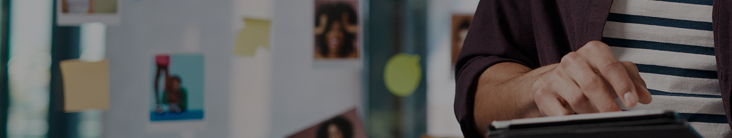 A social media planner reviewing upcoming posts on a tablet.