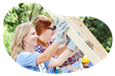A group of volunteers helps build a home.