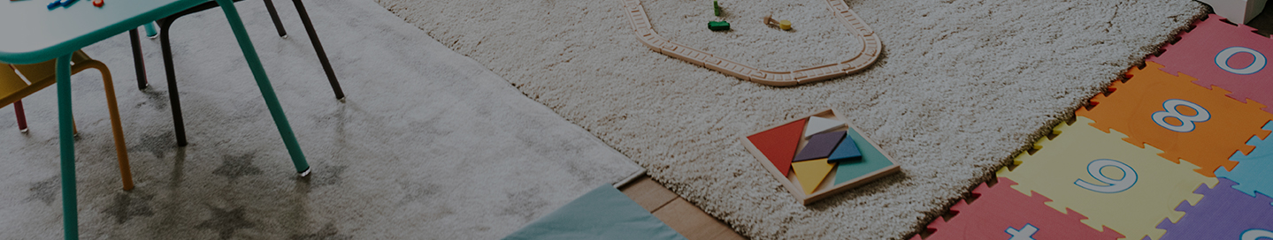 Childcare center play room with toys.
