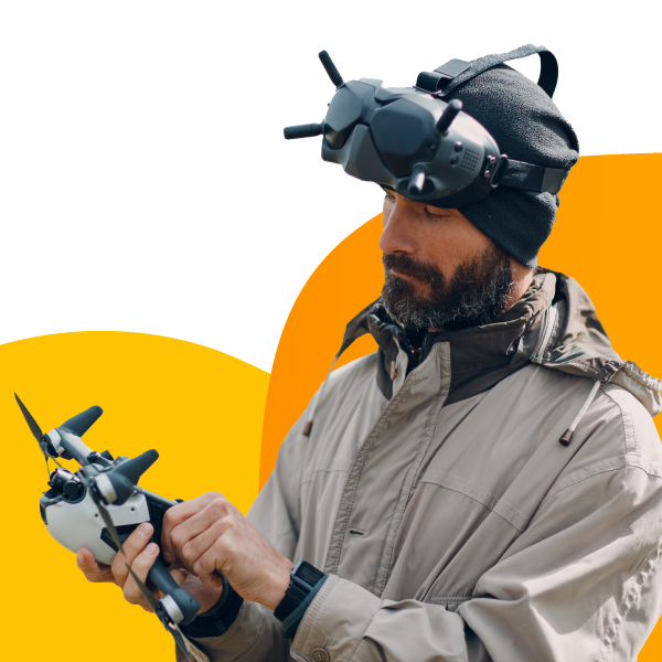 A drone photographer adjusting the settings on their drone