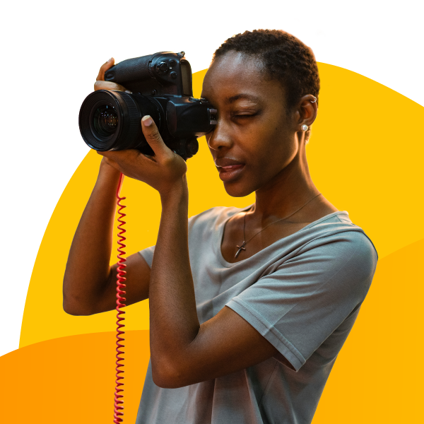 A photographer taking a picture with strong focus