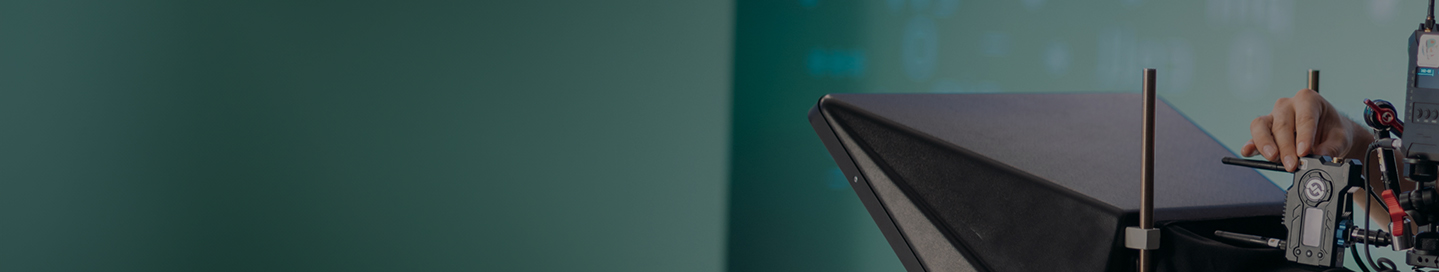 A photographer sets up their camera for a photo shoot A photographer sets up their camera for a photo shoot