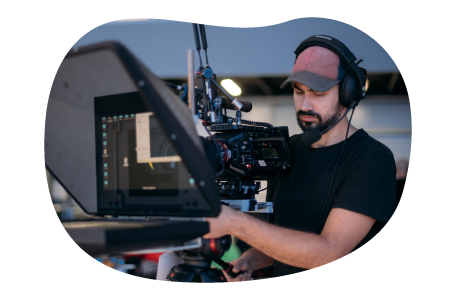 A production studio owner carefully captures footage for a project