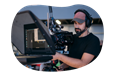 A production studio owner carefully captures footage for a project