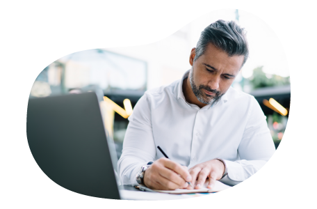 A claims adjuster writing notes in response to an insurance claim