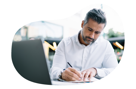 A claims adjuster writing notes in response to an insurance claim A claims adjuster writing notes in response to an insurance claim